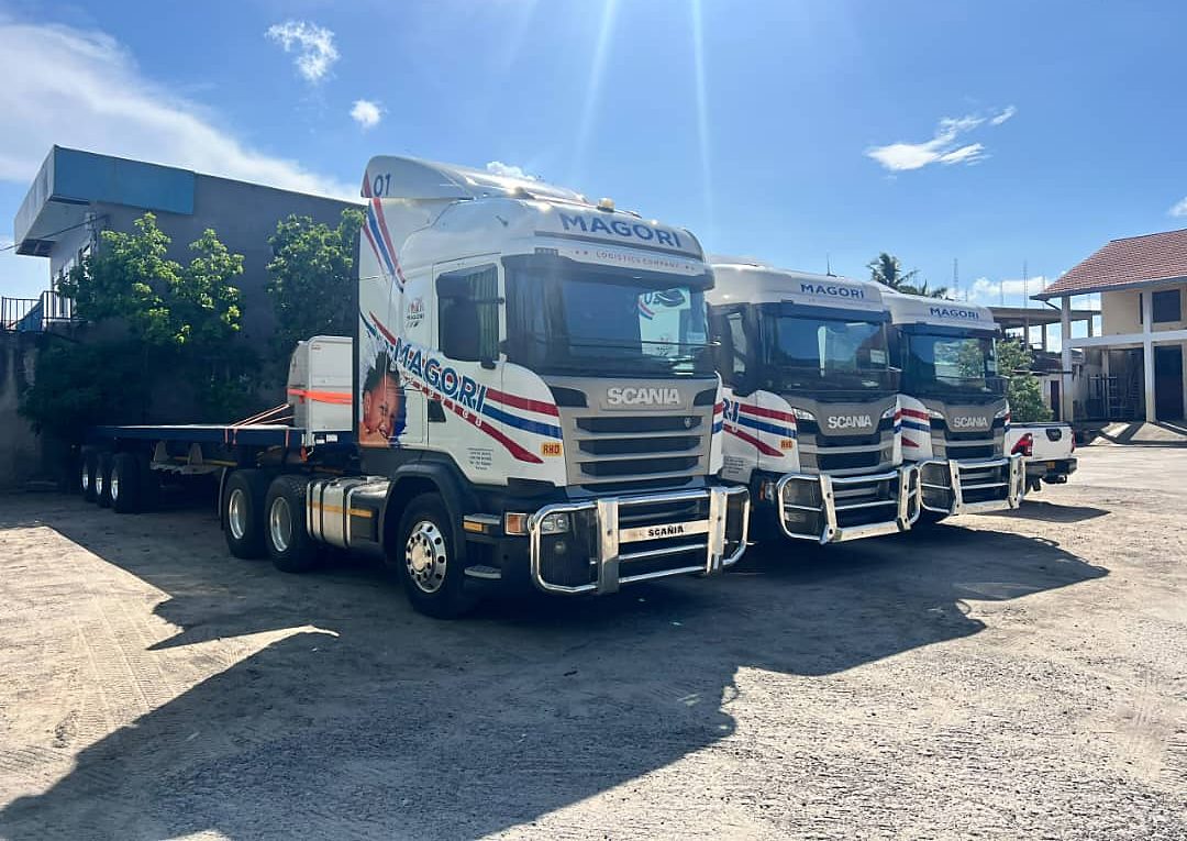 A Magori tractor unit and flatbed trailer ready to load