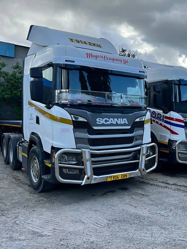 A Magori truck head-on, lined up with two more