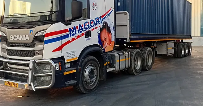 A Magori Logistics truck delivering a container at a warehouse